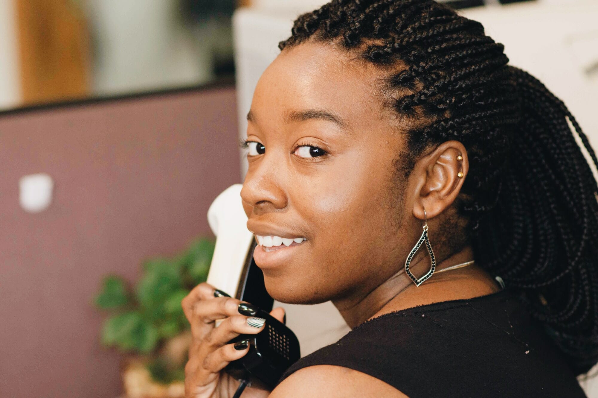 African American receptionist on phone