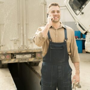 Happy Repairman Talking On Phone